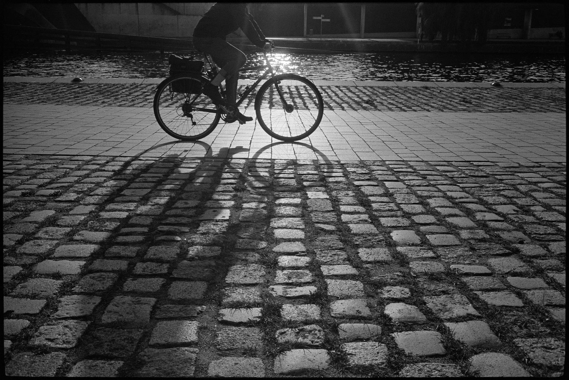 cyclist in front of the sun