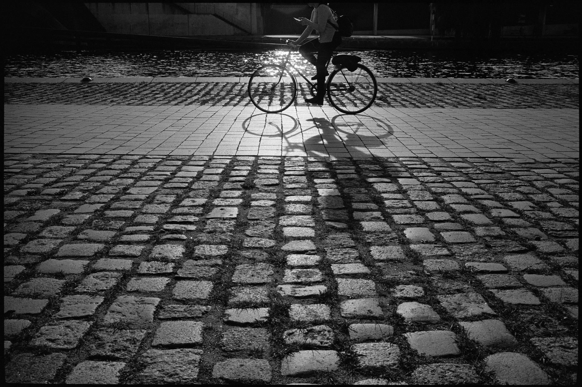 cyclist in front of the sun