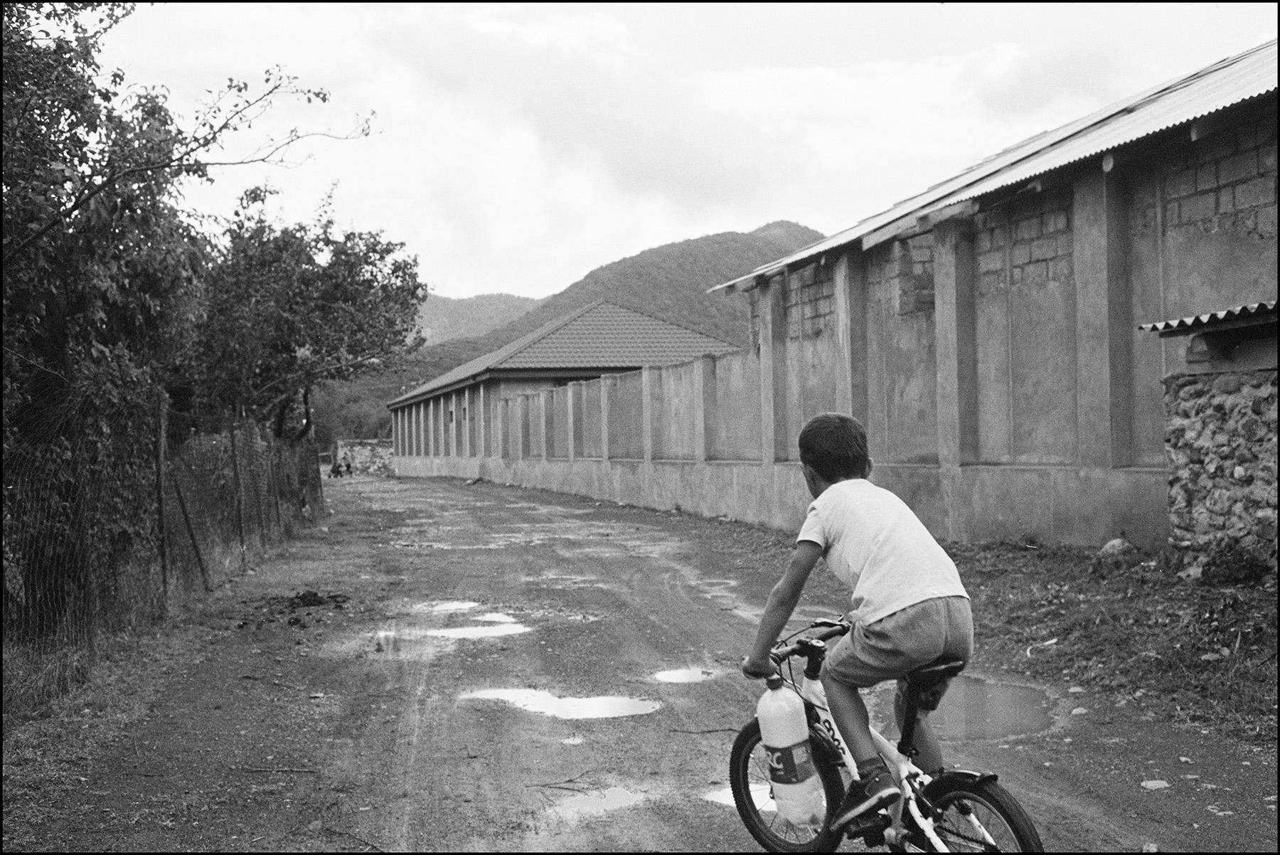 a kid riding a bike