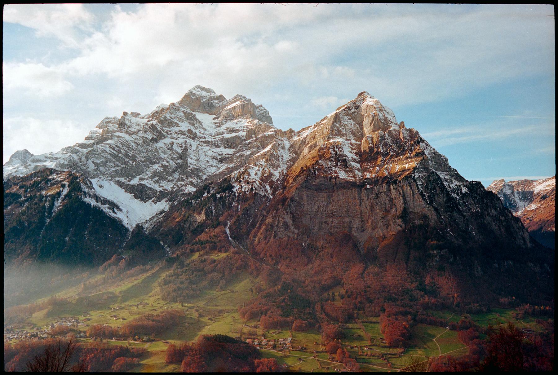 snow convered mountains in autumn