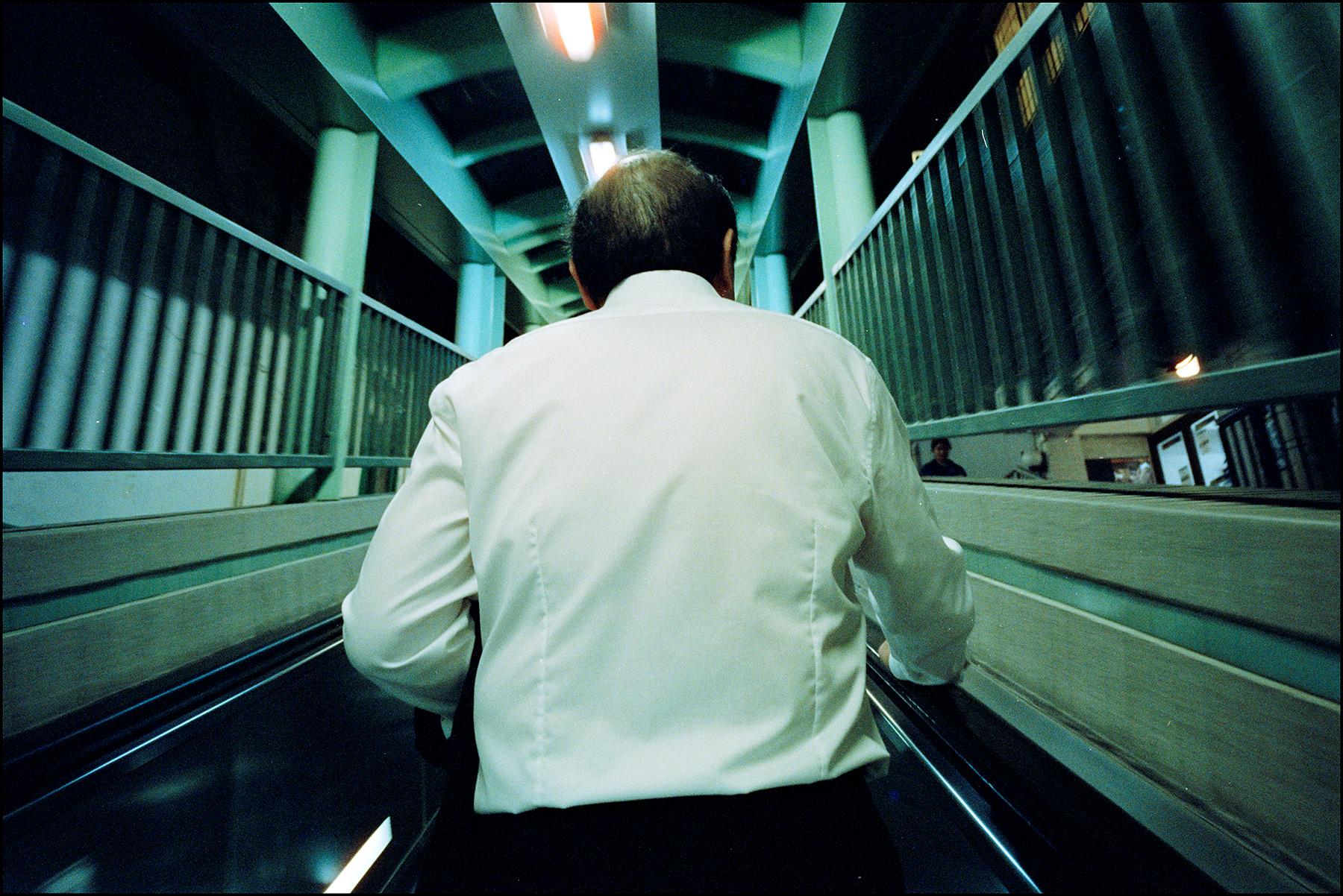 man on escalator